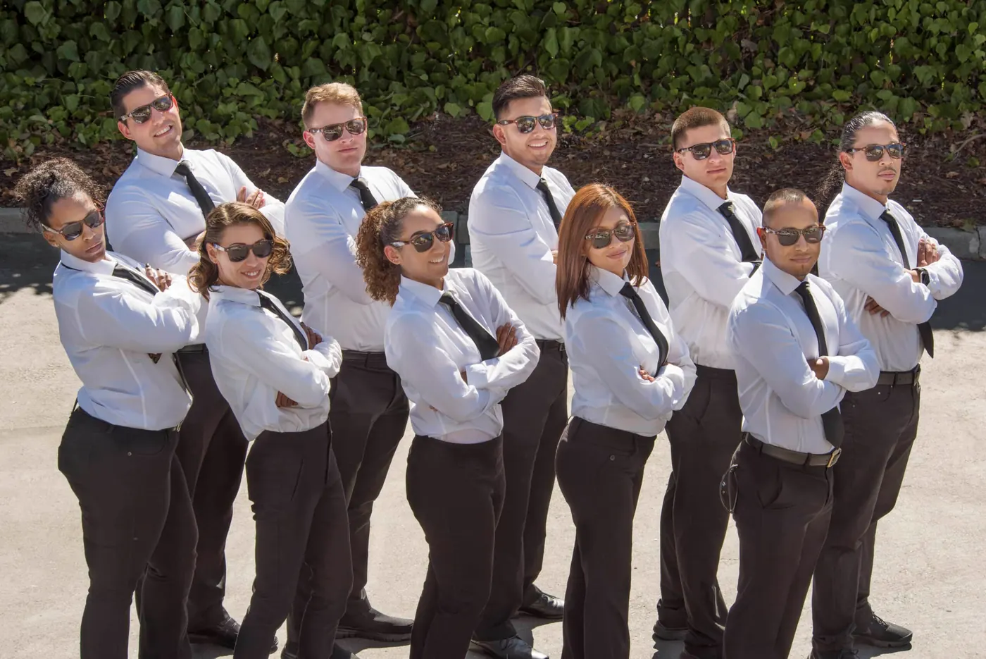 The All About Parking valet team in white uniforms