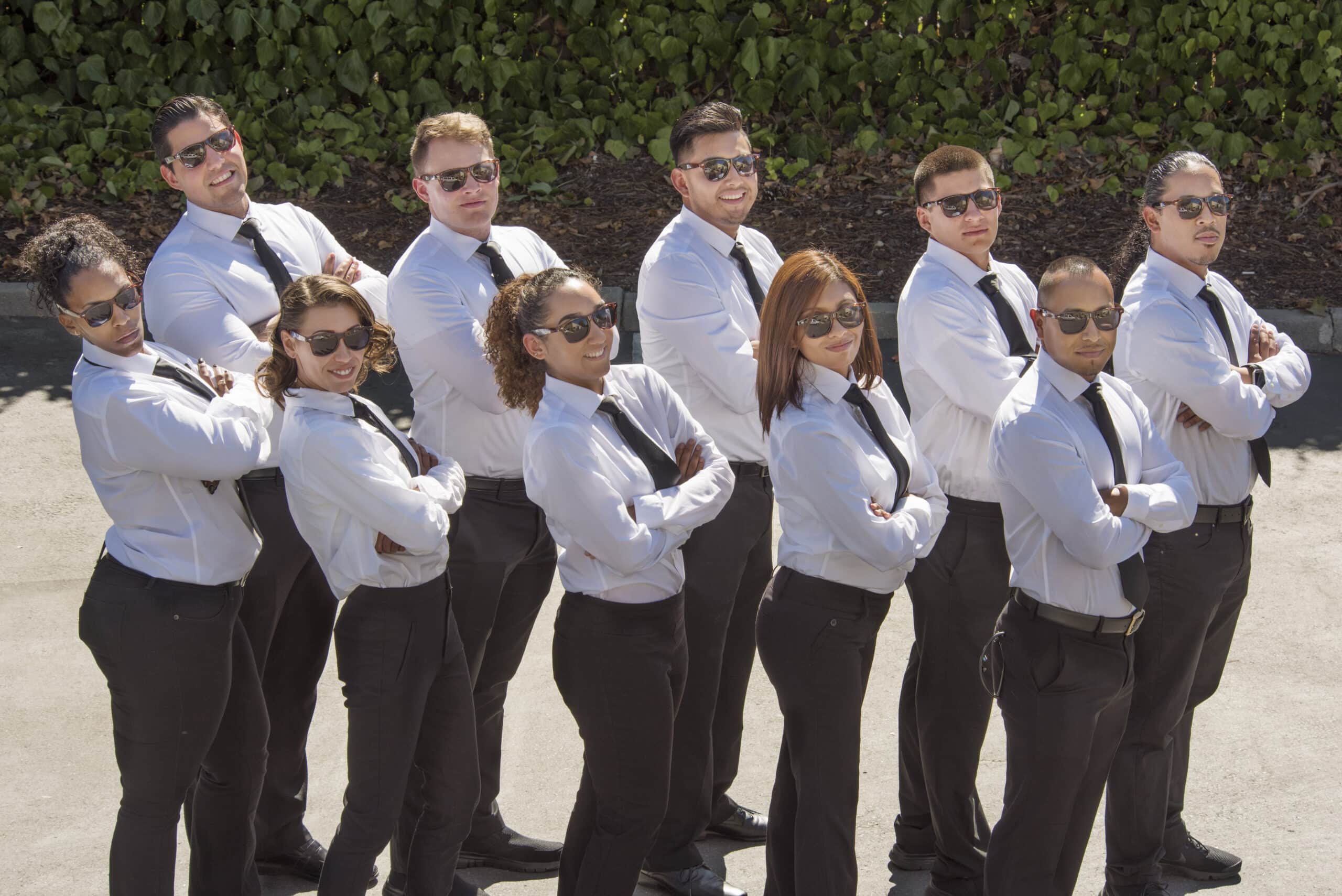 The All About Parking valet team in white uniforms